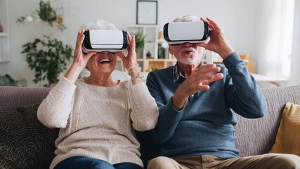 Elderly Couple Enjoying Virtual Reality Experience Together at Home – Innovation Connection and Joy in the Future of Technology - Powered by Adobe
