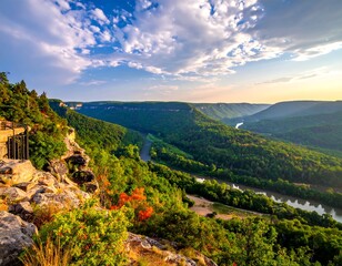Panoramic vista of a river winding through a mountainous valley at sunrise