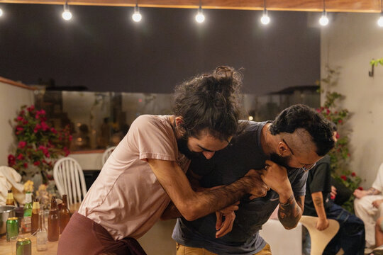 Drunk Men Playfully Wrestling 