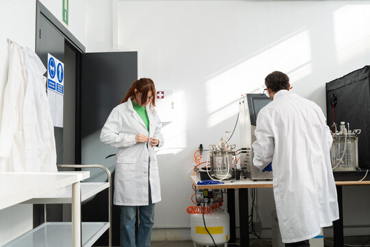 scientists working in biotech laboratory