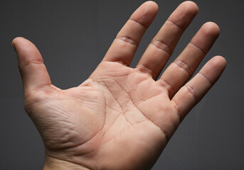 Open hand close up showing palm lines for palm reading and fortune telling concept