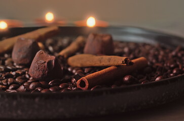A Cozy Autumn Decoration with Candles, Chocolate Truffles, and Cinnamon - A Festive Tray with...