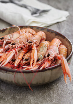 Cooked langoustines in a bowl.