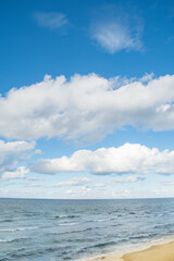 An ordinary summer coastline with an empty sandy beach.