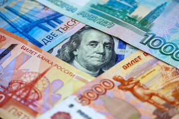 US dollar surrounded of russian rubles. Concept of exchange rate, american sanctions against Russia