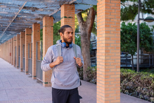 Sportsman walking in park after training