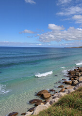 Scenic ocean view with gentle waves and clear blue skies  