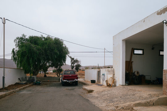 Outdoor Garage and Red Pickup Truck