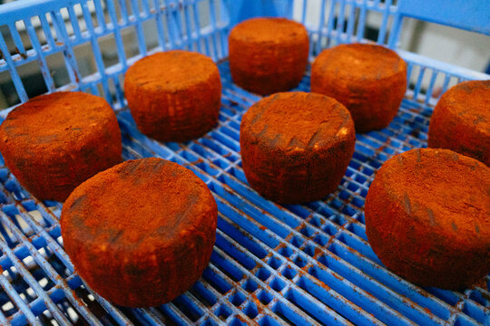Artisanal Cheeses In Blue Plastic Crate