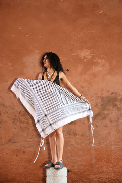 Woman Showing a Palestinian keffiyeh