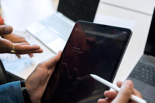 Businessman holding tablet  with internet error in hands.