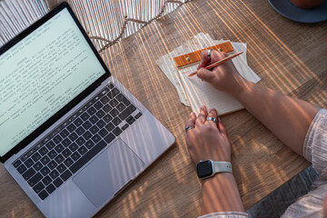 Writer taking notes while creating a screenplay for movie 