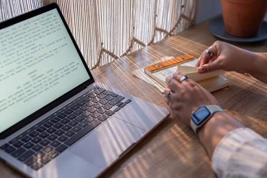 Working on a Project at a Wooden Desk in a Cozy Workspace