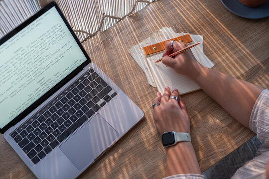 Writer taking notes while creating a screenplay for movie 