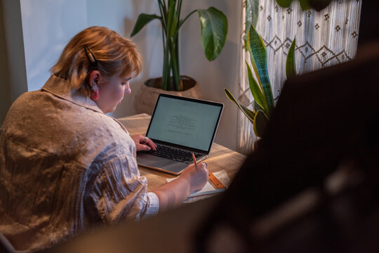 Busy woman working at home office