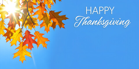 Happy Thanksgiving header or web banner, Canadian fall panoramic background, sun, yellow maple leaves and blue sky in Canada