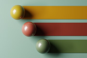 Three Glossy Colored Balls with Long Shadows on Pastel Background