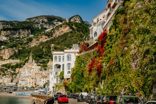 Amalfi coastal road in Italy with mountain town and sea