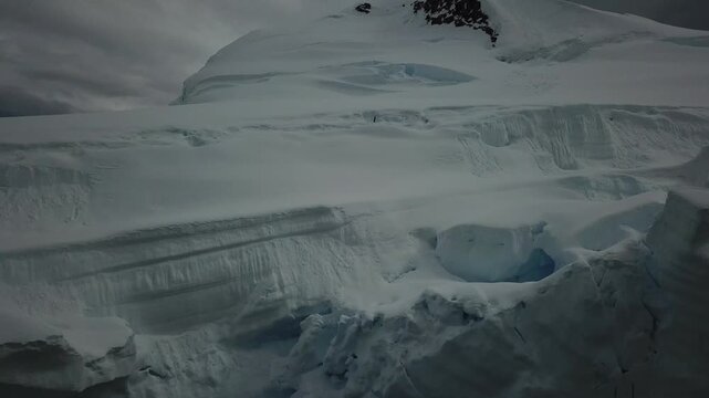 Antarctica Winter Mountains Coastal Scenery, Dramatic Clouds and Sky in Cold Dark Blue Landscape with Glaciers and Ocean Sea Water on Coast, Antarctic Peninsula Seascape in Moody Atmospheric Scene