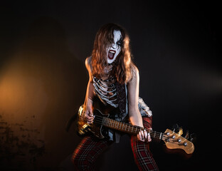 Energetic Female Rock Musician Playing Electric Bass