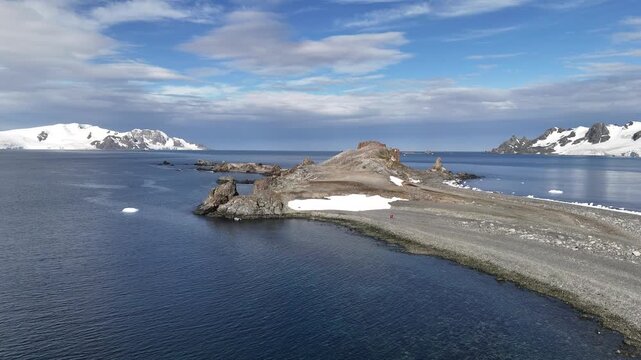 A beautiful cape jutting out into the sea. The beautiful coastline of Antarctica. View from above.