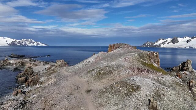 A beautiful cape jutting out into the sea. The beautiful coastline of Antarctica. View from above.