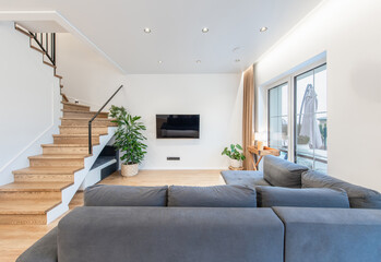 Modern Home Living Room Interior with Large Windows. TV Screen, Sofa, Couch 