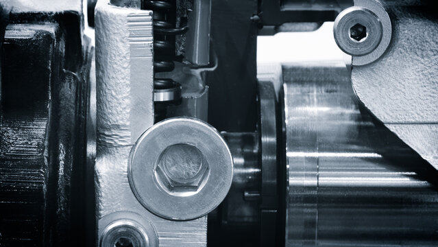 Close up of engine with the pistons and valves visible. Concept of precision and detail, as the viewer can see the inner workings of the engine.