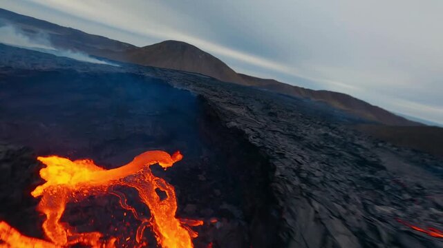 FPV drone flying low over  cooling lava field.