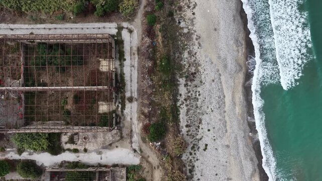 Aerial drone view of Campofelice di Roccella, a charming Sicilian seaside village in northern Sicily, Italy, showing traditional holiday homes, coastline, and panoramic Tyrrhenian Sea vistas