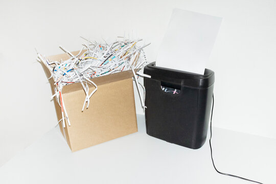 Paper shredder chipper and paper chaff in work business office 