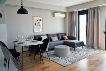 Modern Living Room Design Featuring Cozy Sofa, Elegant Dining Area, and Contemporary Décor in a Bright, Spacious Apartment Setting