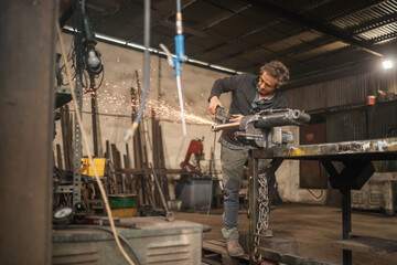 Blacksmith working in workshop