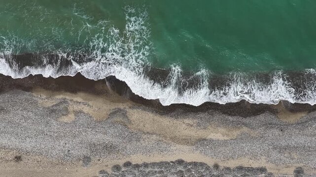 Aerial drone view of Campofelice di Roccella, a charming Sicilian seaside village in northern Sicily, Italy, showing traditional holiday homes, coastline, and panoramic Tyrrhenian Sea vistas