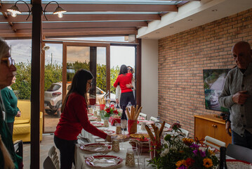 Family Gathering Celebrates Special Occasion in Cozy Interior Space