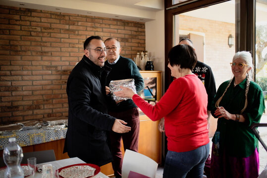 Friends Gather for a Festive Celebration in a Cozy Indoor Setting