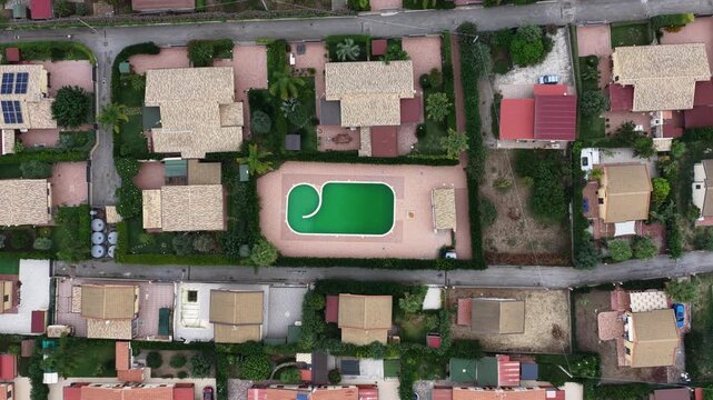 Aerial drone view of Campofelice di Roccella, a charming Sicilian seaside village in northern Sicily, Italy, showing traditional holiday homes, coastline, and panoramic Tyrrhenian Sea vistas