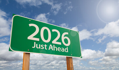 2026 Just Ahead Green Road Sign Over Clouds and Blue Sky.