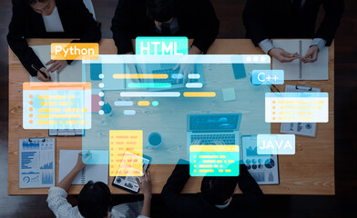 Group of professionals collaborating on a software development project, utilizing laptops and tablets displaying various programming languages in a modern office setting. Trope