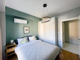 Modern Bedroom Design Featuring Comfortable Bed, Cozy Decor, and Subtle Color Palette Perfect for Relaxation and Aesthetics in a Contemporary Home Setting