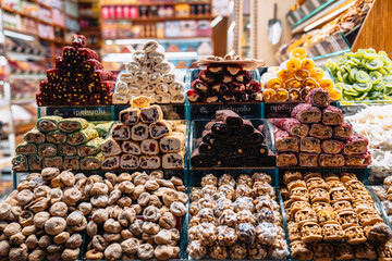View of an array of Turkish delight sweets arranged in neat rows, each pile a vibrant mosaic of color and texture, tempting the senses, Istanbul, Ä°stanbul, TÃ¼rkiye.