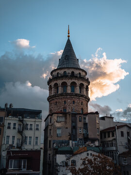 View of the Galata Tower stands tall, a beacon of history against a canvas of dramatic clouds and dusky skies, Istanbul, &Auml;&deg;stanbul, T&Atilde;&frac14;rkiye.
