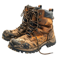 Close-up of a pair of well-worn, brown leather work boots, caked in mud and grime