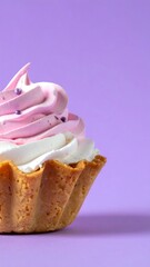Close-up of a pastel-colored dessert.  Whipped cream swirls of pink and white atop a small, fluted pastry shell.  Purple sprinkles add a touch of color.  Against a vibrant purple background