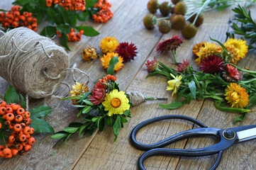 Autumn crafts with strawflowers and berries