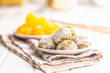 Japanese mochi dessert on plate on checkered napkin.