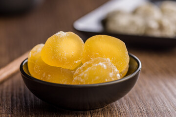 Japanese mochi dessert in bowl on wooden table.