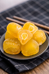 Japanese mochi dessert on plate on wooden table.