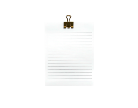 A blank lined paper sheet, clamped by a gold metal binder clip, against a black background