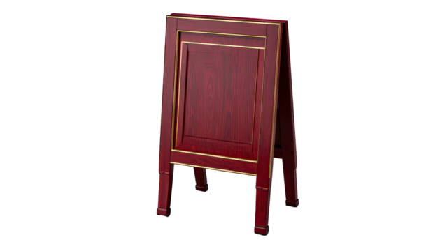 A red wooden easel-style sign with gold trim stands against a black background
